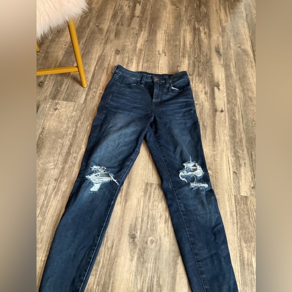 American eagle, blue, size 4, has holes in the knees